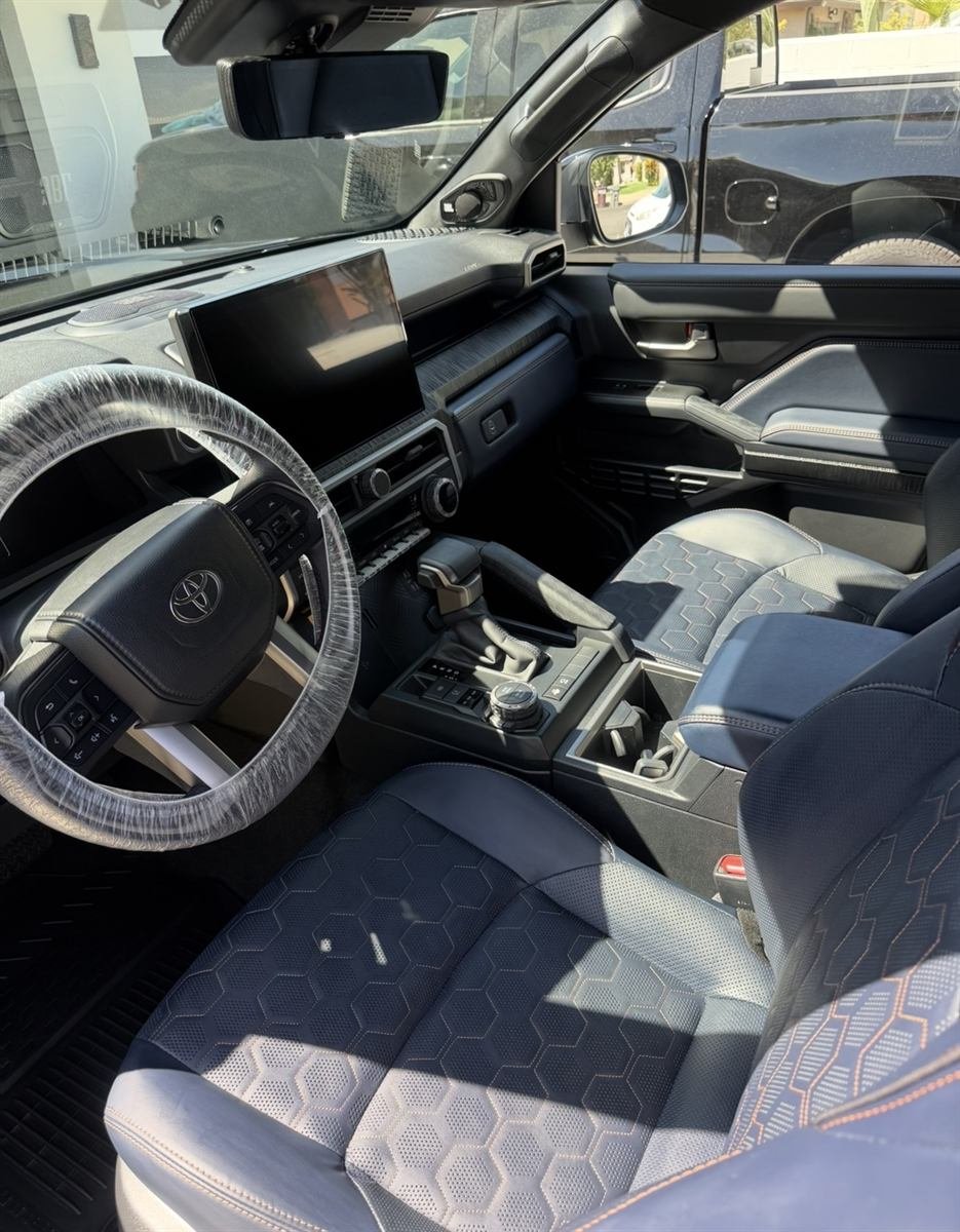 Detailed SUV interior with clean stitched seats and dashboard